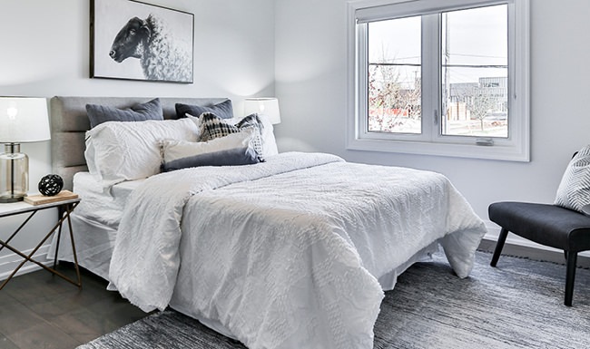 Bedroom with natural lighting and high ceilings